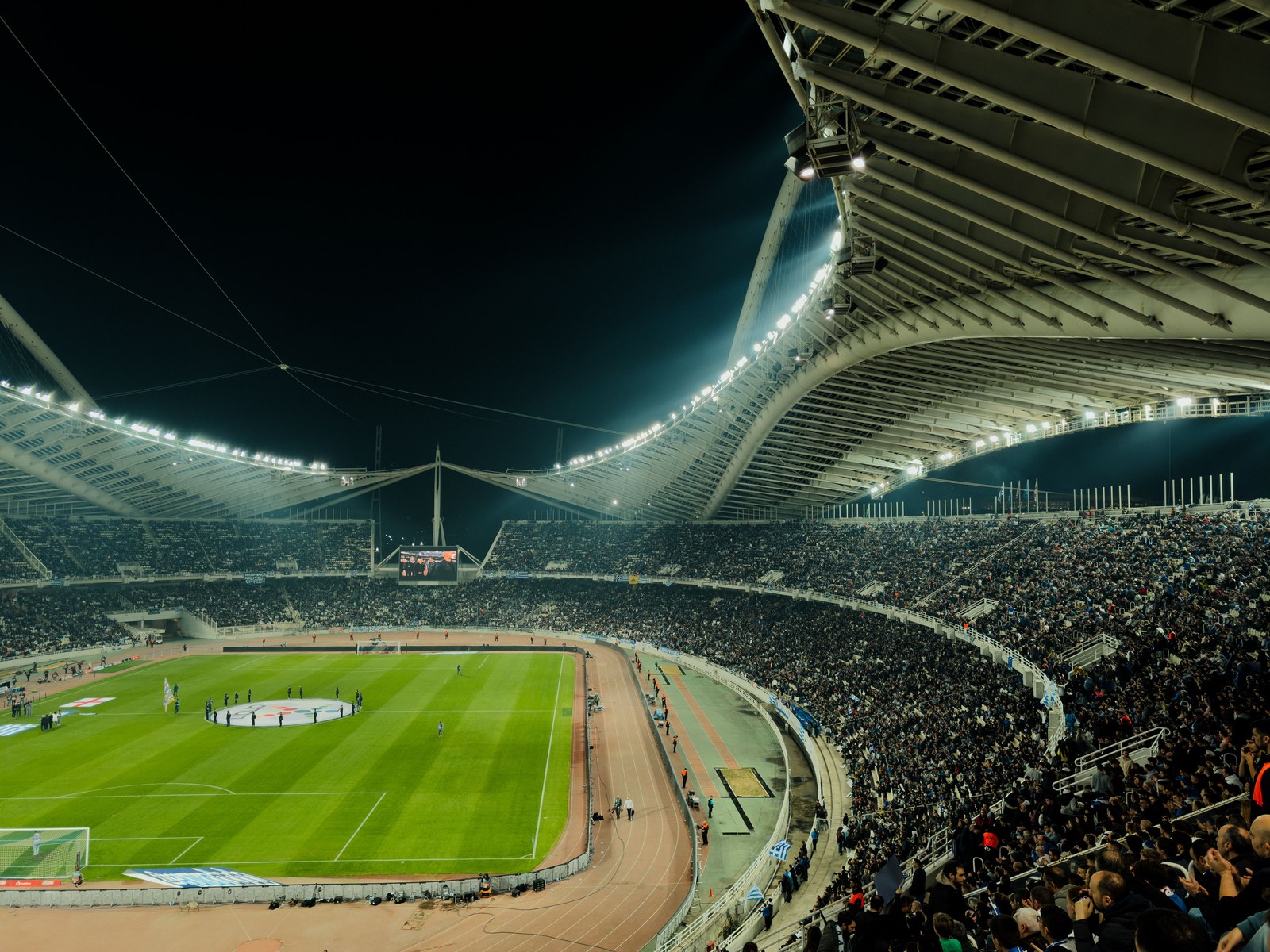 SimianX AI Floodlit World Cup stadium packed with fans at night SimianX AI Floodlit World Cup stadium packed with fans at night